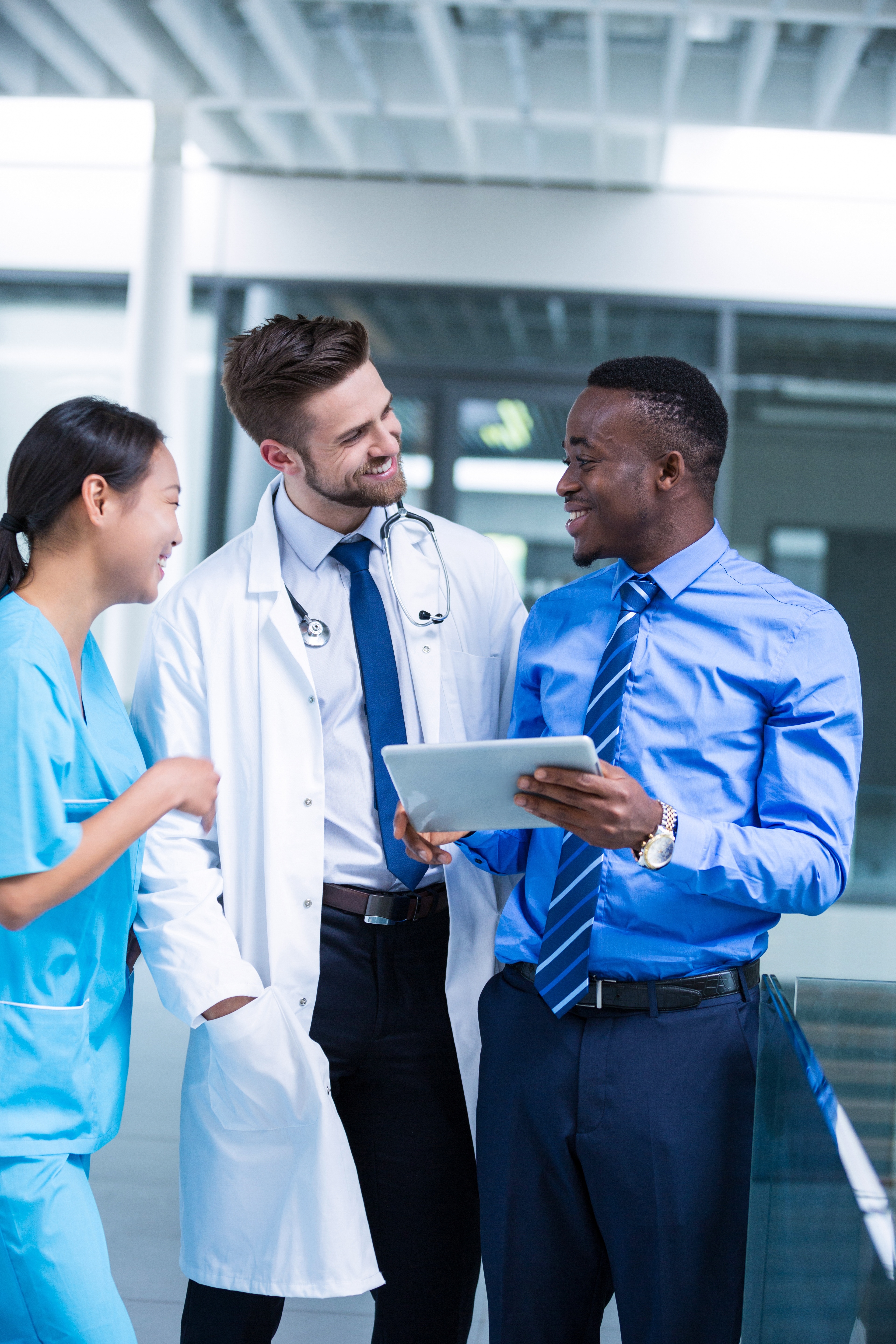 Nurse and doctor having a discussion with businessman