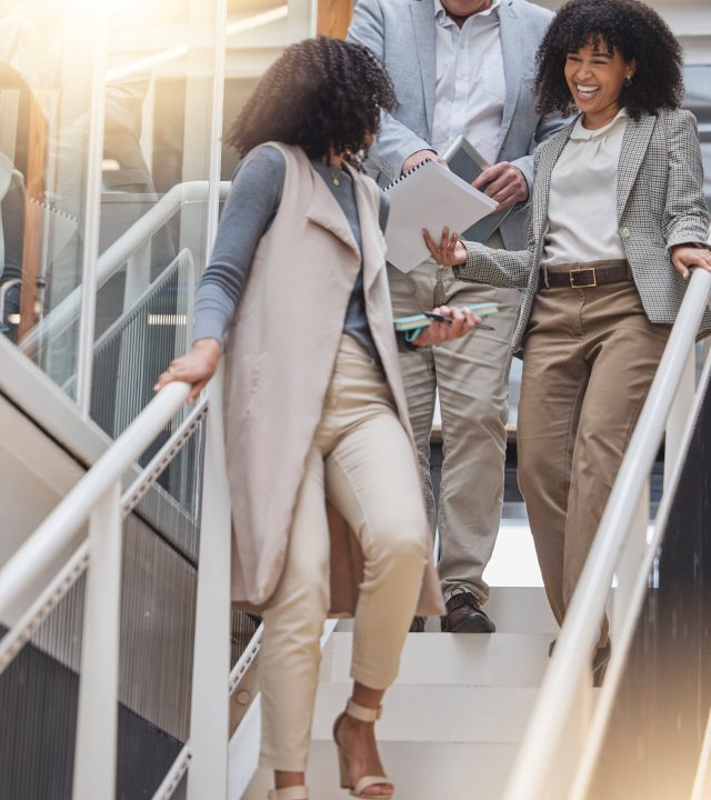 Discussion, office and business people on stairs walking to meeting for planning, strategy and chatting at work. Teamwork, corporate workplace and happy workers with notebook, documents and report